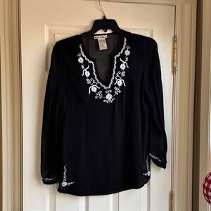 Ami Elegant Black Top with White Floral Details